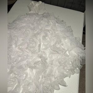 Beautiful mermaid fit wedding gown with a long train.